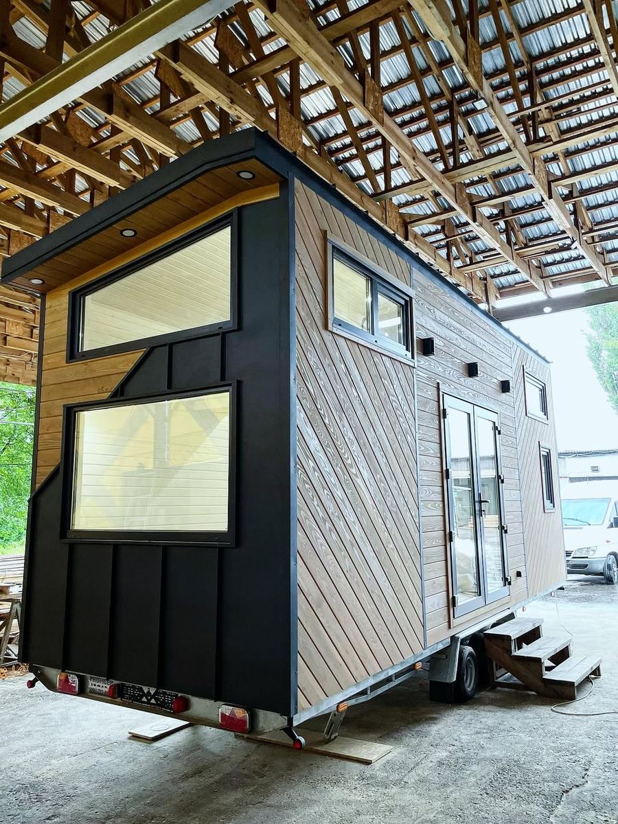 Prefab house exterior — diagonal timber cladding